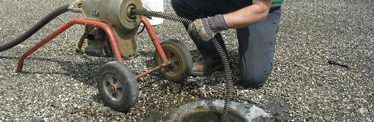 sewer rodding technician actively removing blockages from a sewer line in Tacoma, WA