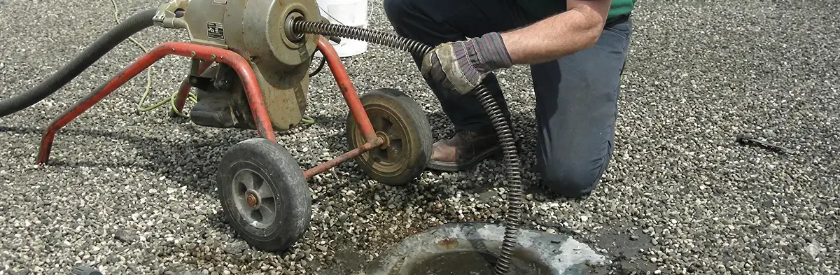 sewer rodding technician actively removing blockages from a sewer line in Tacoma, WA