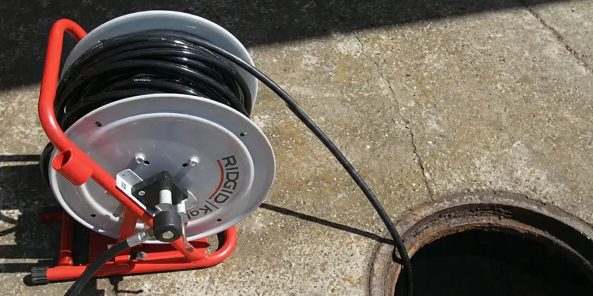 sewer rodding equipment prepared to clear clogged sewer lines in Tacoma, WA