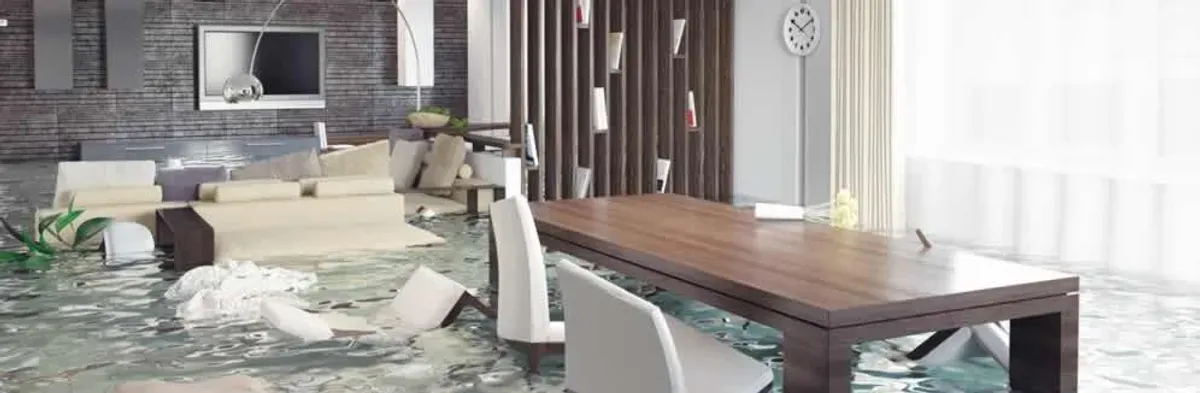 home interior affected by water damage with flooded floors and displaced furniture in Tacoma, WA